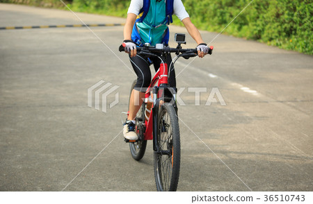 cyclist cycling mountain bike on trail 36510743