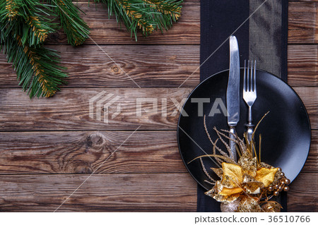 Christmas table place setting with black napkin Christmas table place setting with black napkin 36510766