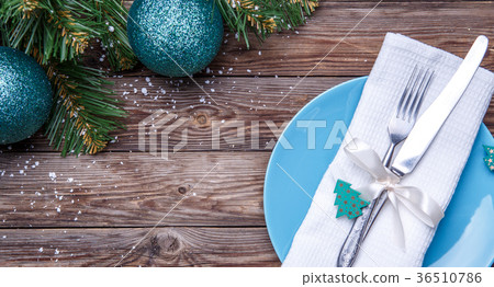 Christmas table place setting with blue plate 36510786