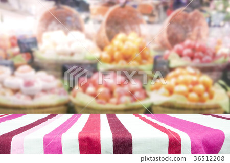 Wood table top on fruit store background. 36512208