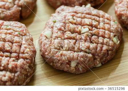 Hamburgers on cutting board Hamburgers on cutting board 36515296
