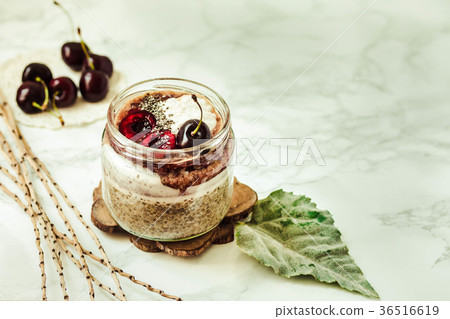 Chia pudding in a jar with fresh cherry,coconut cr Chia pudding in a jar with fresh cherry,coconut cr 36516619