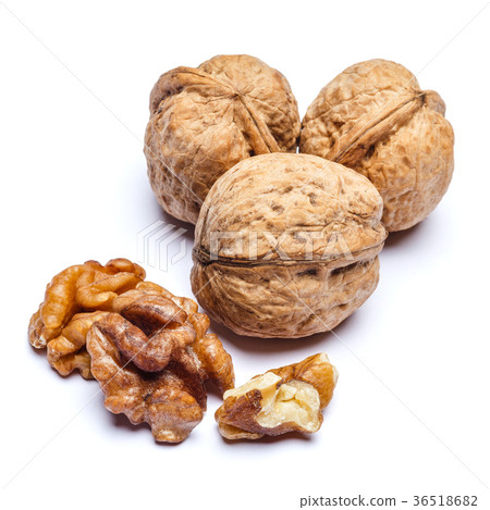 three whole walnuts isolated on white background three whole walnuts isolated on white background 36518682