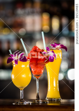 Still life with 3 cocktails and orchid flowers 36519465