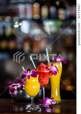 Still life with 3 cocktails and orchid flowers 36519467
