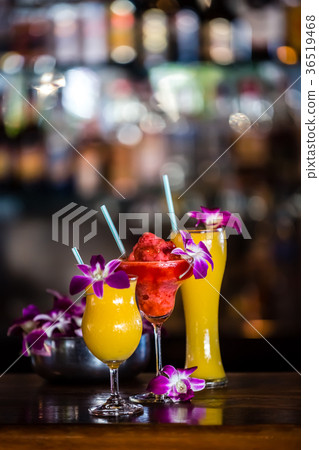 Still life with 3 cocktails and orchid flowers 36519468
