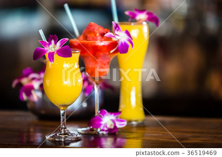 Still life with 3 cocktails and orchid flowers 36519469