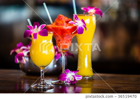 Still life with 3 cocktails and orchid flowers 36519470