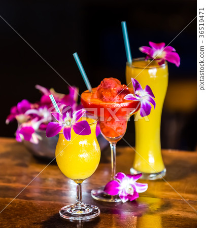 Still life with 3 cocktails and orchid flowers 36519471