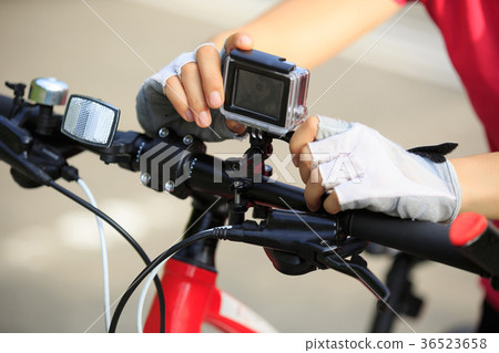 cyclist set the action camera on mountain bike 36523658