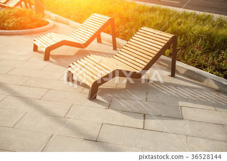 Sun loungers on the public park in the street Sun loungers on the public park in the street 36528144