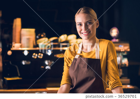 Cheerful girl working in confectionary shop 36529701