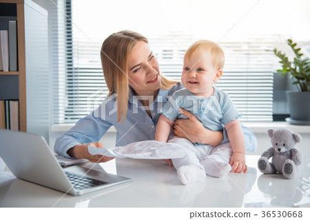 Happy businesswoman working and taking care of 36530668