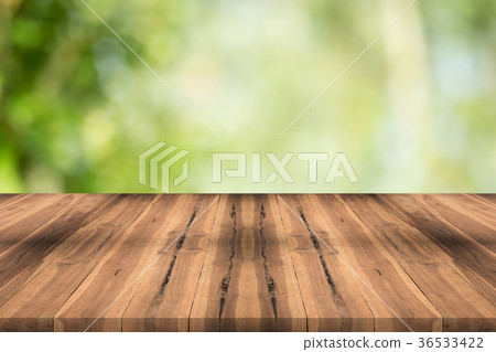 Wood table top on nature green blurred background 36533422
