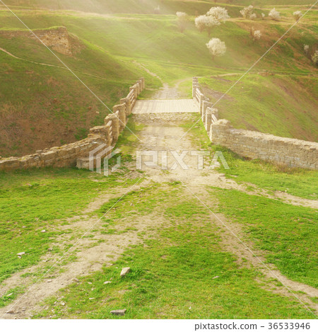 Antique old roman stones bridge. 36533946