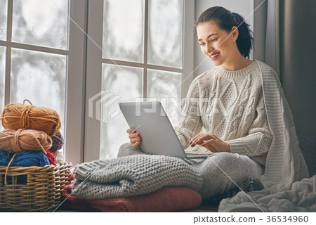 woman sitting near windows 36534960