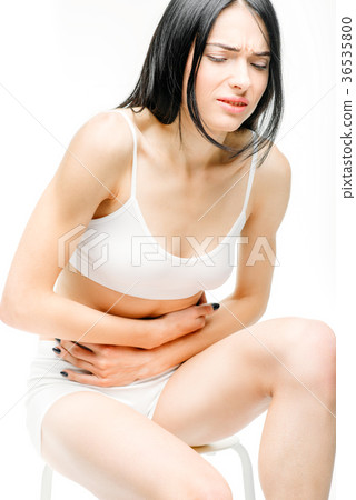 Abdominal pain, female person with stomach problem Abdominal pain, female person with stomach problem 36535800