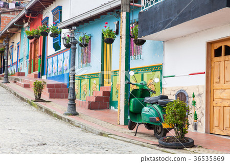 Green motorcycle at the colorful town of Guatape 36535869