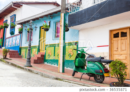 Green motorcycle at the colorful town of Guatape 36535871