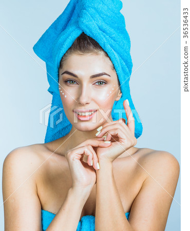 Woman applying a creme Woman applying a creme 36536433