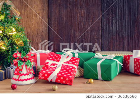 gifts and toys on wooden boards with Christmas gifts and toys on wooden boards with Christmas 36536566