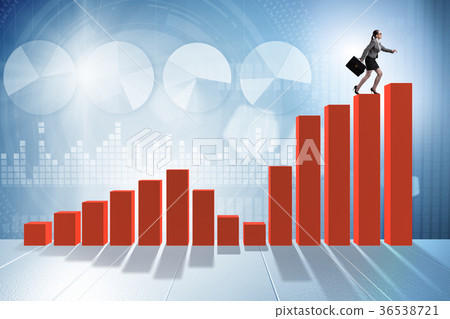 Businesswoman climbing bar chart in economic 36538721