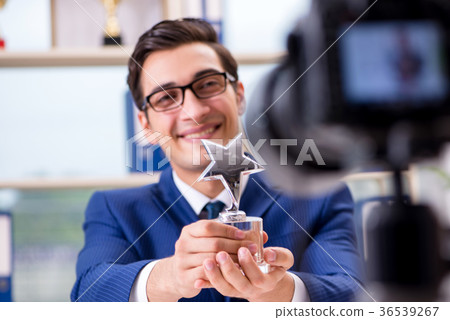 Businessman recording a video for vlog Businessman recording a video for vlog 36539267