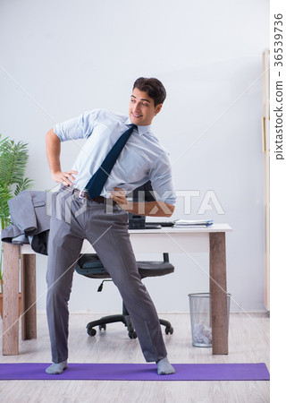 Businessman doing sports in office during break Businessman doing sports in office during break 36539736