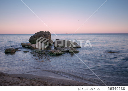 landscape of the sea and stones against sunrise landscape of the sea and stones against sunrise 36540288