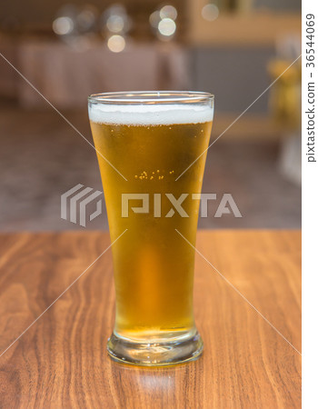 Glass of beer in pub and restaurant Glass of beer in pub and restaurant 36544069