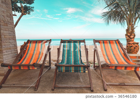 lounge chairs with swimming pool 36546180