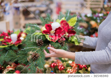 customer woman choosing Christmas decorations 36546940
