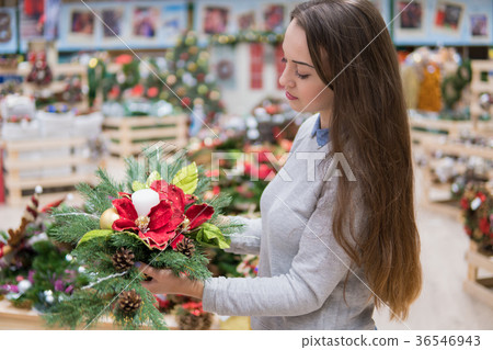 customer woman choosing Christmas decorations 36546943