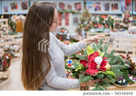 customer woman choosing Christmas decorations customer woman choosing Christmas decorations 36546949