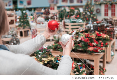 happy customer girl choosing Christmas tree 36546950