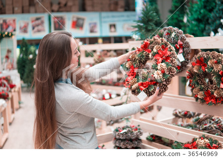 customer woman choosing Christmas decorations 36546969