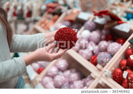 Cheerful happy customer girl choosing Christmas 36546992