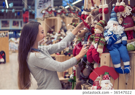 customer girl choosing gifts for Christmas and New 36547022
