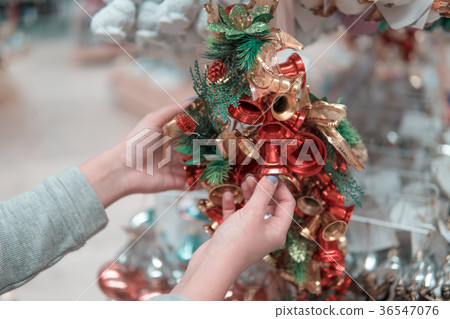 customer girl choosing Christmas tree or New Year 36547076