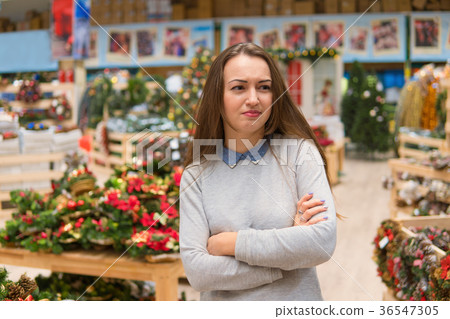 customer girl choosing gifts for Christmas and New customer girl choosing gifts for Christmas and New 36547305