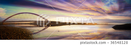 Its a wooden bridge on the lake/ocean/sea 36548128
