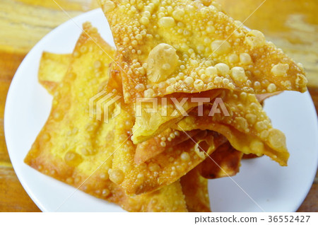 deep fried crispy dumpling strips on dish 36552427