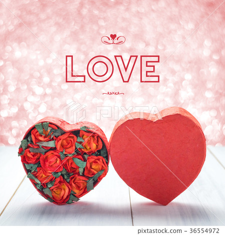 Love with Heart shape with red roses on table Love with Heart shape with red roses on table 36554972