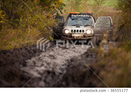 Small off road car stuck in deep mud Small off road car stuck in deep mud 36555177