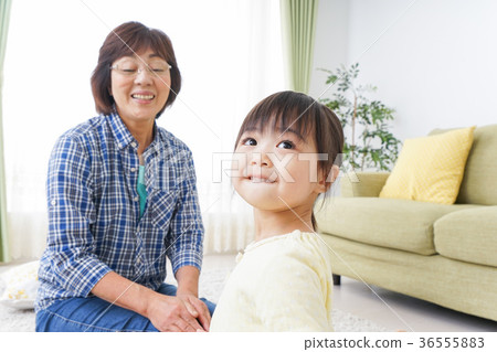 Kids playing in the room with grandma Kids playing in the room with grandma 36555883