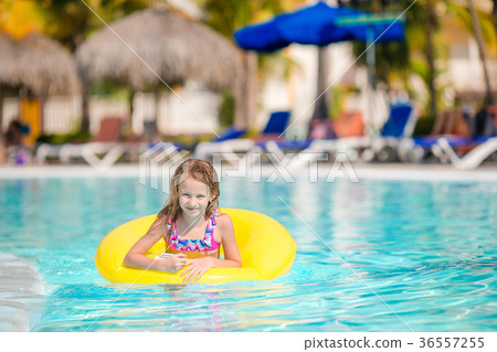 Little girl with inflatable rubber circle having Little girl with inflatable rubber circle having 36557255
