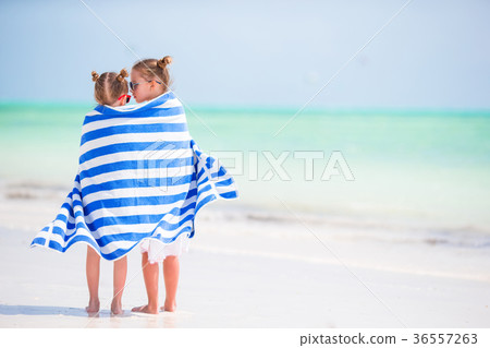 Little cute girls wrapped in towel at tropical Little cute girls wrapped in towel at tropical 36557263