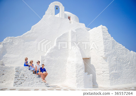 Family of four on the stairs of Paraportiani 36557264