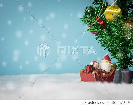 Happy Santa Claus with gifts box on the snow sled Happy Santa Claus with gifts box on the snow sled 36557269