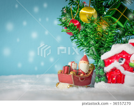 Happy Santa Claus with gifts box on the snow sled Happy Santa Claus with gifts box on the snow sled 36557270